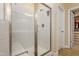 A bright, white, glass-enclosed shower is featured in this view at 4913 Sunset Stream Dr, Fuquay Varina, NC 27526