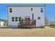 Backyard with an elevated deck and view of the rear of the house, windows, and white siding at 505 Ferry Ct, Wake Forest, NC 27587