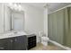 Bathroom featuring a double sink vanity, shower with curtain, and tile flooring at 505 Ferry Ct, Wake Forest, NC 27587