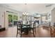 Cozy dining area with a view of the fireplace and sliding glass door, perfect for Gathering meals at 505 Ferry Ct, Wake Forest, NC 27587