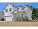 Beautiful two-story home with manicured lawn, appealing shutters, and a cozy, covered front porch at 505 Ferry Ct, Wake Forest, NC 27587