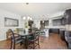 Spacious kitchen with dark wood cabinets, granite countertops, and a center island at 505 Ferry Ct, Wake Forest, NC 27587