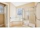 Bathroom featuring a jacuzzi tub, a separate glass shower, and a window offering natural light at 508 Spencer Crest Ct, Cary, NC 27513