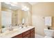 Bathroom with double sink vanity and tile shower offering modern comfort at 508 Spencer Crest Ct, Cary, NC 27513
