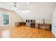 Bonus room with custom desks, ample shelving, and a ceiling fan providing a comfortable workspace at 508 Spencer Crest Ct, Cary, NC 27513