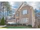 Elegant brick home featuring manicured landscaping, multi-pane windows, and attached garage at 508 Spencer Crest Ct, Cary, NC 27513