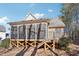 Back view of home featuring a screened in porch with a wooden deck and brick siding at 508 Spencer Crest Ct, Cary, NC 27513