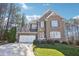 Beautiful two-story brick home featuring manicured landscaping, a two-car garage, and a welcoming front entrance at 508 Spencer Crest Ct, Cary, NC 27513
