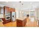 Open-concept kitchen with wood island, stainless steel appliances, and view to the living room at 508 Spencer Crest Ct, Cary, NC 27513