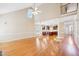Open-concept living space featuring wood floors, natural light, and a view of the kitchen and upper level at 508 Spencer Crest Ct, Cary, NC 27513