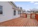 Lovely wood deck featuring a brown wood railing on the side of a well maintained white home at 516 Craven Road, Durham, NC 27704