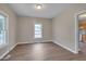 Bright living room with hardwood floors, neutral walls, and lots of natural light at 516 Craven Road, Durham, NC 27704