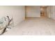 Open basement space with light carpet, neutral paint, and bright lighting at 627 Balsam Fir Dr, Cary, NC 27519