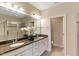 Dual vanity bathroom featuring a walk-in shower, soaking tub, and granite countertops at 627 Balsam Fir Dr, Cary, NC 27519