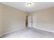 Carpeted bedroom featuring a light fixture, closet and neutral color scheme at 627 Balsam Fir Dr, Cary, NC 27519