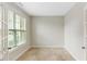 Neutral bedroom with large window for natural light and plush carpeting at 627 Balsam Fir Dr, Cary, NC 27519
