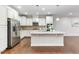 Bright, spacious kitchen with granite countertops, stainless steel appliances, and hardwood flooring at 627 Balsam Fir Dr, Cary, NC 27519