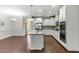 Stylish kitchen featuring granite countertops, stainless steel appliances and white cabinetry at 627 Balsam Fir Dr, Cary, NC 27519