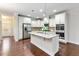 Beautiful kitchen with granite counters, stainless steel appliances and a large center island at 627 Balsam Fir Dr, Cary, NC 27519