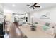 Bright living area with hardwood floors, fireplace, kitchen, and comfortable furniture at 627 Balsam Fir Dr, Cary, NC 27519