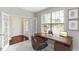 Bright home office featuring French doors, wood floors, and a modern desk setup at 627 Balsam Fir Dr, Cary, NC 27519