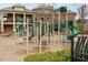 Community playground featuring climbing structures, slides, and soft landing surface, surrounded by mature landscaping at 627 Balsam Fir Dr, Cary, NC 27519