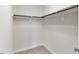 A walk-in closet features built-in shelving and ample hanging space for optimal organization at 627 Balsam Fir Dr, Cary, NC 27519