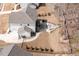 An aerial view showcasing the backyard featuring a patio with seating and a fire pit at 664 The Parks Dr, Pittsboro, NC 27312