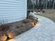 Paver patio features a fire pit and outdoor seating area at 664 The Parks Dr, Pittsboro, NC 27312