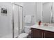 Bathroom featuring a glass shower, modern fixtures, and a neutral color palette at 664 The Parks Dr, Pittsboro, NC 27312