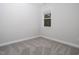 A bright bedroom space enhanced by a picture window with natural light at 664 The Parks Dr, Pittsboro, NC 27312