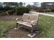 Park bench in common area providing residents a space to relax and enjoy the natural beauty of the community at 664 The Parks Dr, Pittsboro, NC 27312