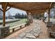 Stone pathway leads through the community outdoor pavilion with seating and natural views for gatherings at 664 The Parks Dr, Pittsboro, NC 27312