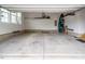 A spacious garage with ample storage space and room for parking, perfect for car storage and other hobbies at 664 The Parks Dr, Pittsboro, NC 27312