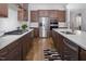 Open kitchen features a large island, modern appliances, granite countertops, and lots of storage at 664 The Parks Dr, Pittsboro, NC 27312