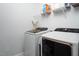 Modern laundry room featuring new washer and dryer units and storage shelves at 664 The Parks Dr, Pittsboro, NC 27312
