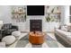 Bright and airy living room features a fireplace, built-in shelving, and neutral decor at 664 The Parks Dr, Pittsboro, NC 27312