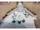 A backyard paver patio with comfortable seating surrounding a fire pit, perfect for outdoor gatherings at 664 The Parks Dr, Pittsboro, NC 27312