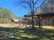A wooden pergola provides shaded areas and adds architectural interest to the natural surroundings at 664 The Parks Dr, Pittsboro, NC 27312