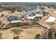 An aerial perspective captures a community clubhouse, pool, and meticulously manicured golf course at 721 Sage Oak Ln, Holly Springs, NC 27540