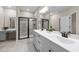 Modern bathroom with dual sinks, gray cabinets, and tiled shower with glass door at 721 Sage Oak Ln, Holly Springs, NC 27540