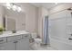 Bathroom featuring a single sink vanity, toilet, and shower/tub combo at 721 Sage Oak Ln, Holly Springs, NC 27540