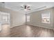 Spacious bedroom features a ceiling fan, recessed lights and natural light from the windows at 721 Sage Oak Ln, Holly Springs, NC 27540