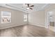 Relaxing bedroom features recessed lighting, a ceiling fan and lots of natural light at 721 Sage Oak Ln, Holly Springs, NC 27540