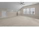 Large bedroom with carpet and many windows at 721 Sage Oak Ln, Holly Springs, NC 27540