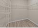 Walk-in closet with wood flooring and plenty of shelf space at 721 Sage Oak Ln, Holly Springs, NC 27540