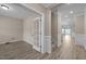 Inviting foyer featuring wood floors, and glass doors to a front room at 721 Sage Oak Ln, Holly Springs, NC 27540