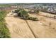 Scenic aerial view of a golf course with lush greenery, sand traps, and surrounding trees at 721 Sage Oak Ln, Holly Springs, NC 27540