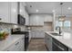 Contemporary kitchen featuring stainless steel appliances, and white countertops at 721 Sage Oak Ln, Holly Springs, NC 27540