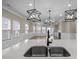 Open-concept kitchen with granite countertops and views into the living room at 721 Sage Oak Ln, Holly Springs, NC 27540